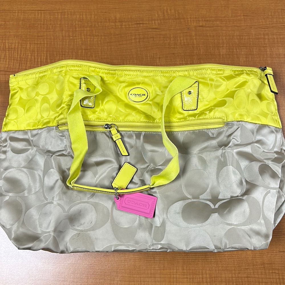 Super cute coach tote with detachable mini bag.